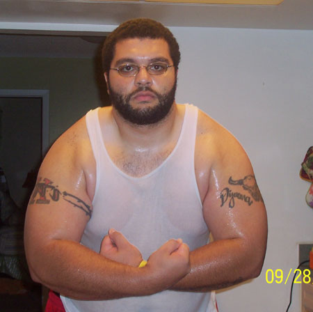 Sweaty and flexing after a hard workout session.